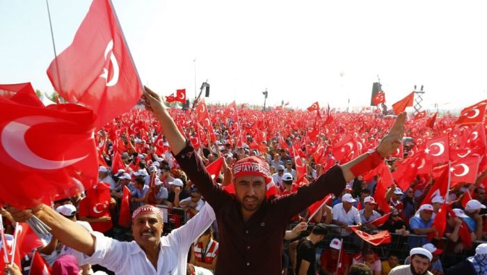 People wave Turkey's national flags during the Democracy and Martyrs Rally, organized by Turkish President Tayyip Erdogan and supported by ruling AK Party (AKP), oppositions Republican People's Party (CHP) and Nationalist Movement Party (MHP), to protest against last month's failed military coup attempt, in Istanbul, Turkey, August 7, 2016.