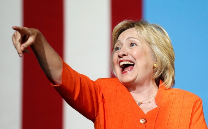 U.S. Democratic presidential nominee Hillary Clinton waves as she arrives during a campaign rally in Kissimmee, Florida, U.S. August 8, 2016.