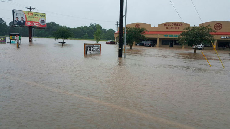 Verot School Rd is seen covered in floodwaters in this handout picture taken by the Louisiana Department of Transportation and Development in Lafayette Parish, Louisiana, U.S. August 12, 2016.