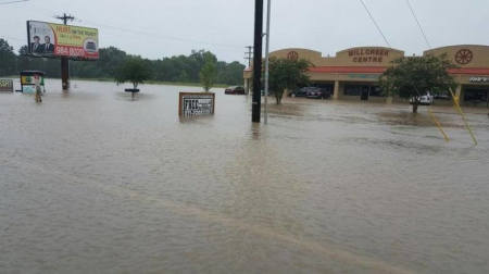 Verot School Rd is seen covered in floodwaters in this handout picture taken by the Louisiana Department of Transportation and Development in Lafayette Parish, Louisiana, U.S. August 12, 2016.