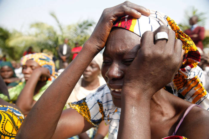 The mother of a missing Chibok girl reacts during a march, with other women calling for their daughters to be brought back home, to the presidential villa in Abuja, Nigeria January 14, 2016. Picture taken January 14, 2016.