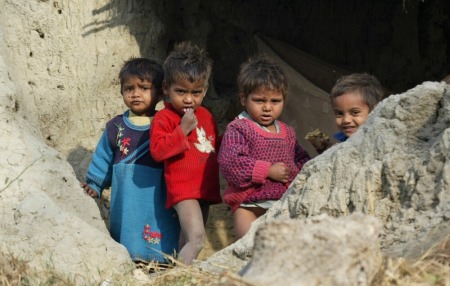 Children of Dalits stand inside a broken house on the outskirts of the northern Indian city of Lucknow January 16, 2008.