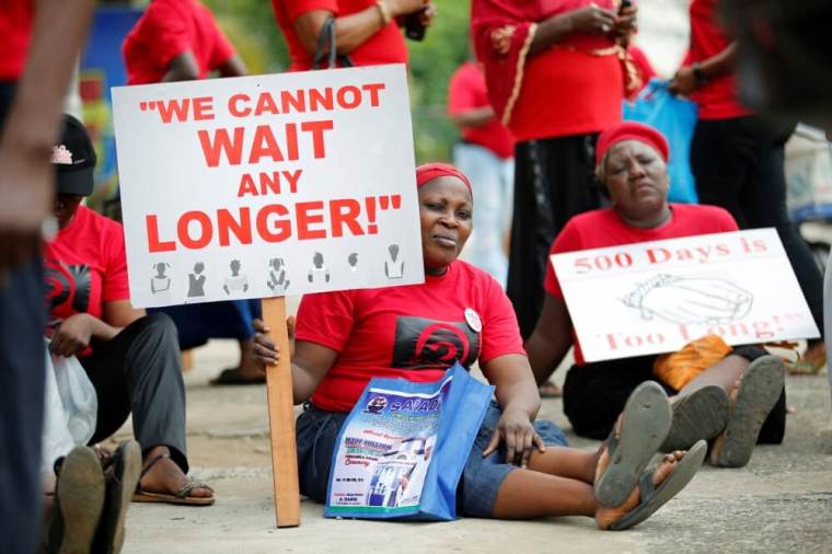 Women carrying placards attend a street protest campaigning for the rescue of abducted Chibok girls, in the Ikeja district of Lagos, Nigeria, April 14, 2016.