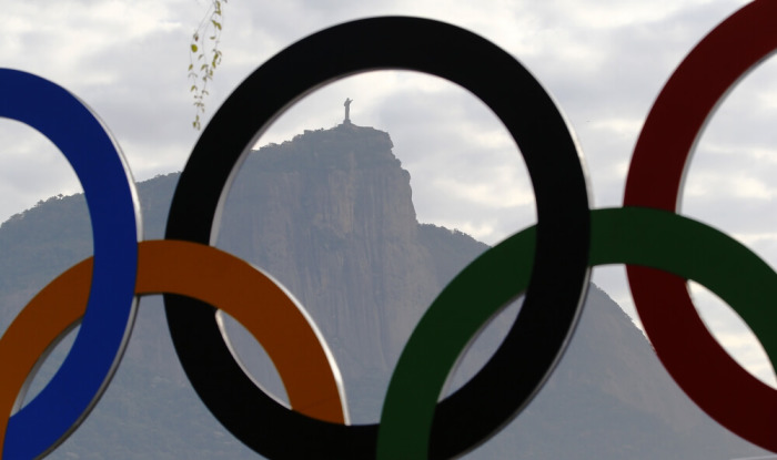 Jesus Christ The Redeemer seen through Olympic Rings at Rodrigo de Freitas Lake, a rowing training session venue in Rio de Janeiro, Brazil, August 2, 2016.