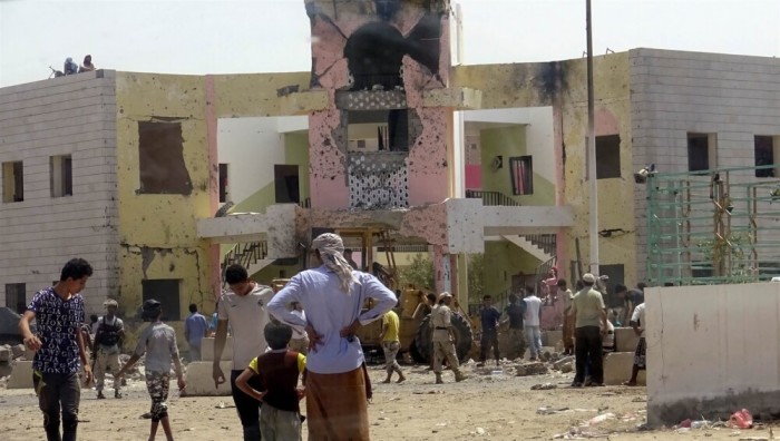 People gather at the scene following an ISIS attack in Aden, Yemen, on August 29, 2016.