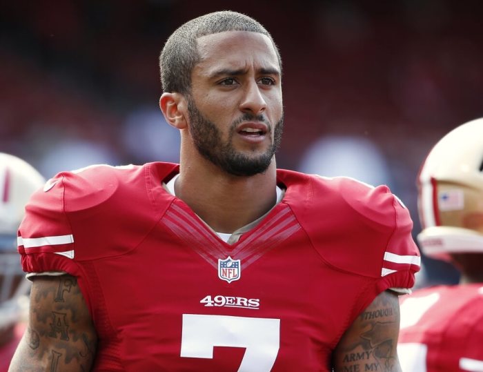 San Francisco 49ers quarterback Colin Kaepernick stands on the field before their NFL pre-season football game against the Denver Broncos in San Francisco, California, August 8, 2013.