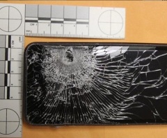 Cell Phone Saves Man's Life: 'Miracle' as Convenience Store Clerk's Mobile Stops Robber's Bullet