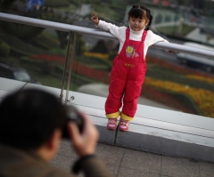 China to Ease One Child Policy and End Labor Camp Program