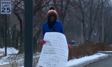 Teen Forced to Stand on Street Corner Holding Jesus Sign as Punishment After Being Suspended for Fighting at School