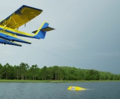 Extreme Sports Athletes Water Ski Barefoot Behind an Airplane