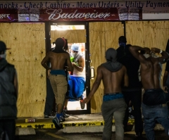 Tensions Return After Police Identify Officer Who Shot Michael Brown; Black Teen's Friend Admits They Were Stealing Cigars From Store