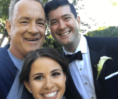 Tom Hanks Reveals He's an Ordained Minister While Crashing Couple's Wedding Photo Shoot (Watch)