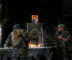 Iraqi Christians Worship Amid Charred Church Ruins for First Time Since Liberation