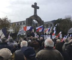 Hundreds Protest After French Court Orders Cross Be Removed From Pope John Paul II Statue