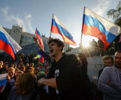 Russians Protest Putin Ahead of Election; Opposition Leader Detained