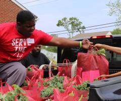 Church gives away two cars, 100,000 pounds of food in relief effort