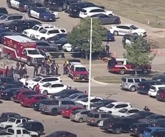 Texas high school shooting suspect turns himself in after wounding 4