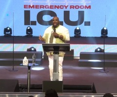 Pastor John Gray praises God as he leaves hospital after health scare