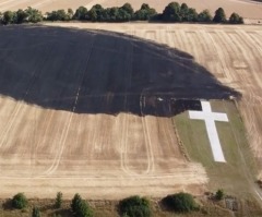 Lenham memorial cross unscathed by field fire that scorched ground during UK heatwave