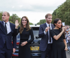 Harry and Meghan unexpectedly join William and Kate to greet crowds paying tribute to Queen Elizabeth II