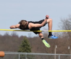 Male athlete takes first place in girls' high jump championship meet