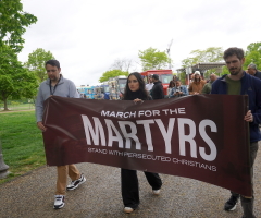 'Ask God for their protection': Demonstrators march through the rain to stand with persecuted Christians