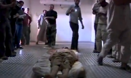 Gaddafi Dead: Video Emerges of Body in Meat Locker as Officials Dispute Burial (PHOTO)