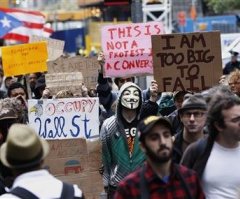 Michael Moore Challenged At Occupy Denver